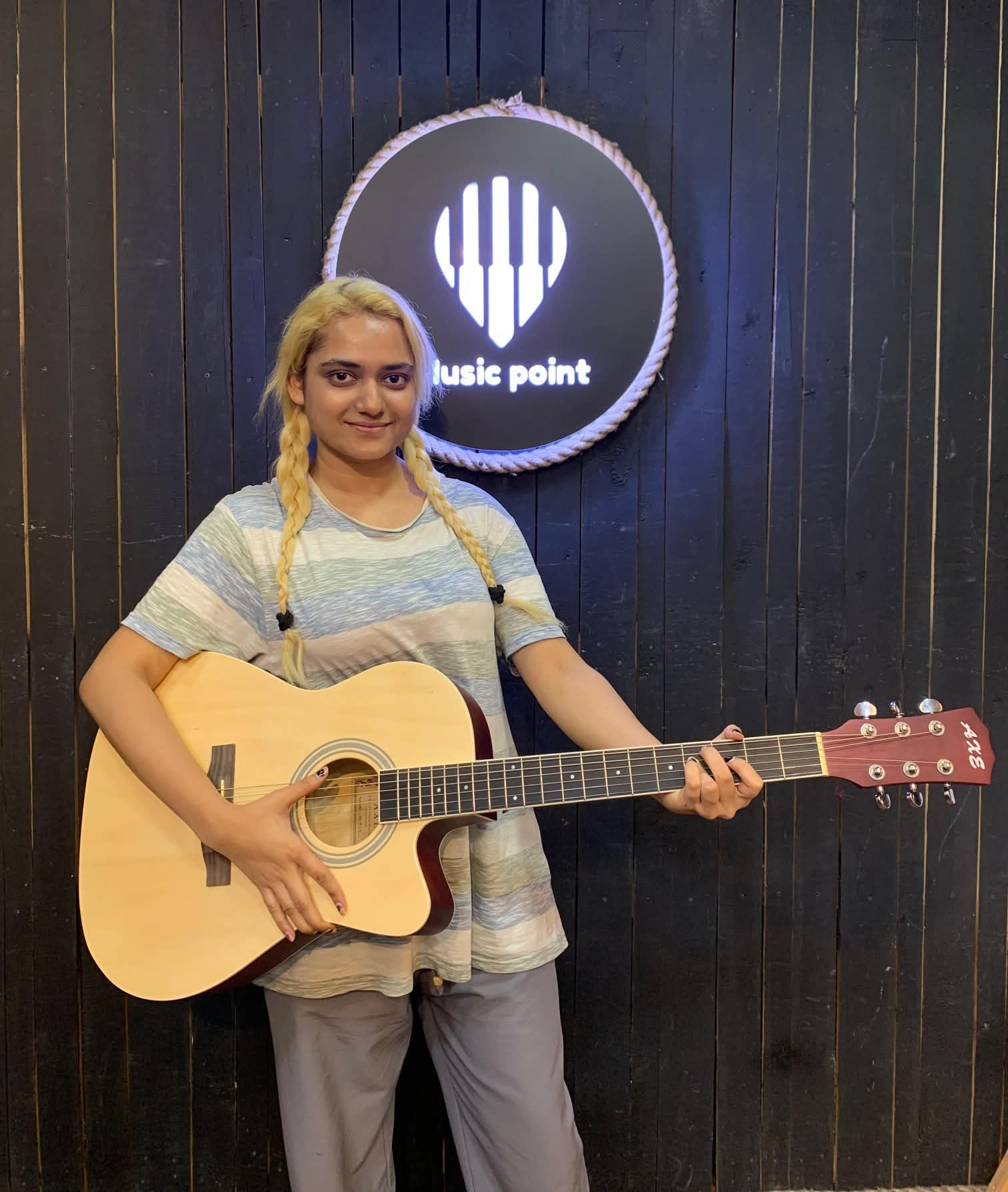 Music Point Customer with Acoustic Guitar at Music Point