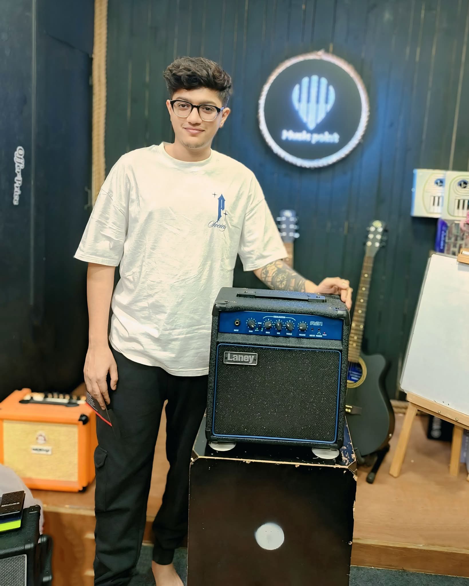Music Point Customer with Guitar Amplifier at Music Point