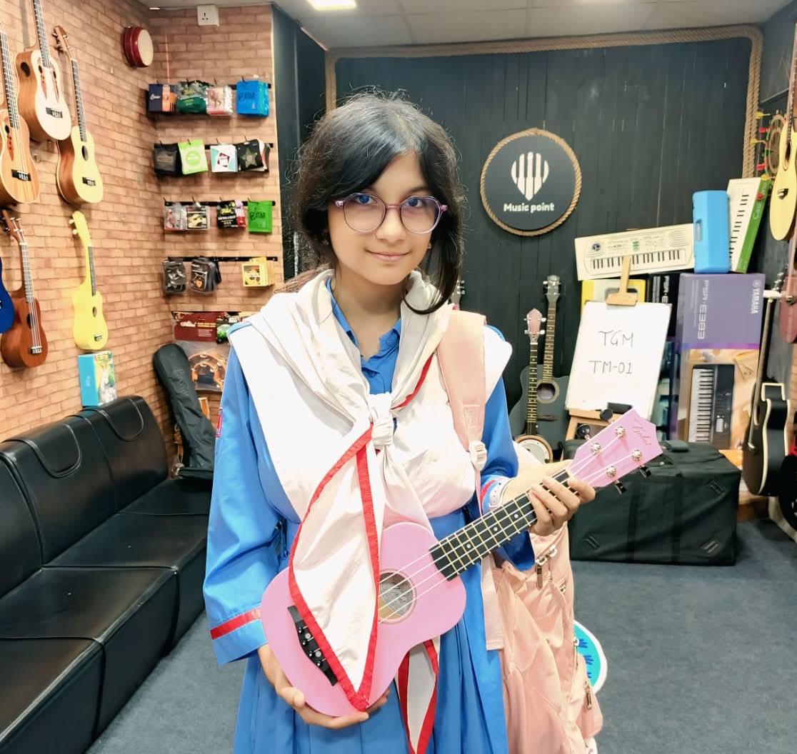 Music Point Customer with Ukulele at Music Point