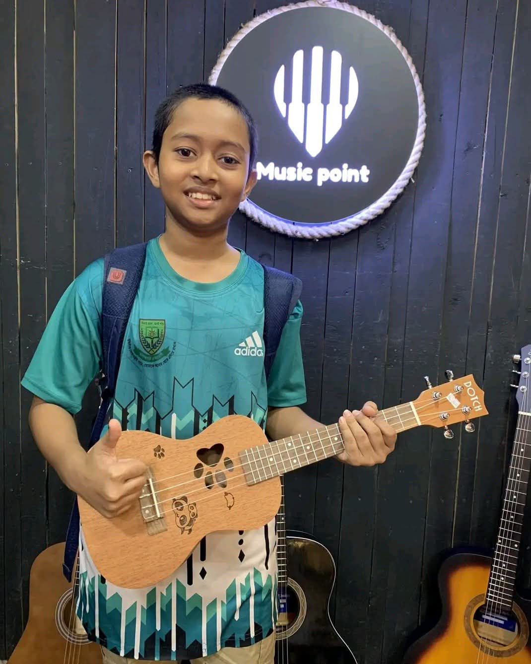 Music Point Customer with Ukulele at Music Point